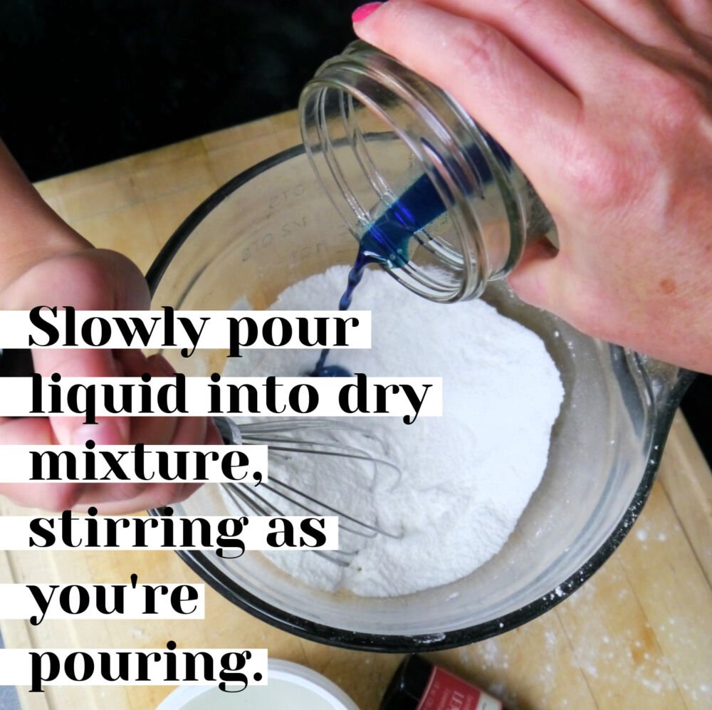 Pouring liquid into white powder mixture