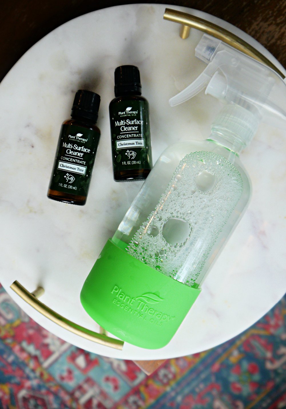 2 bottles of Christmas Tree Cleanser and 1 large spray bottle.