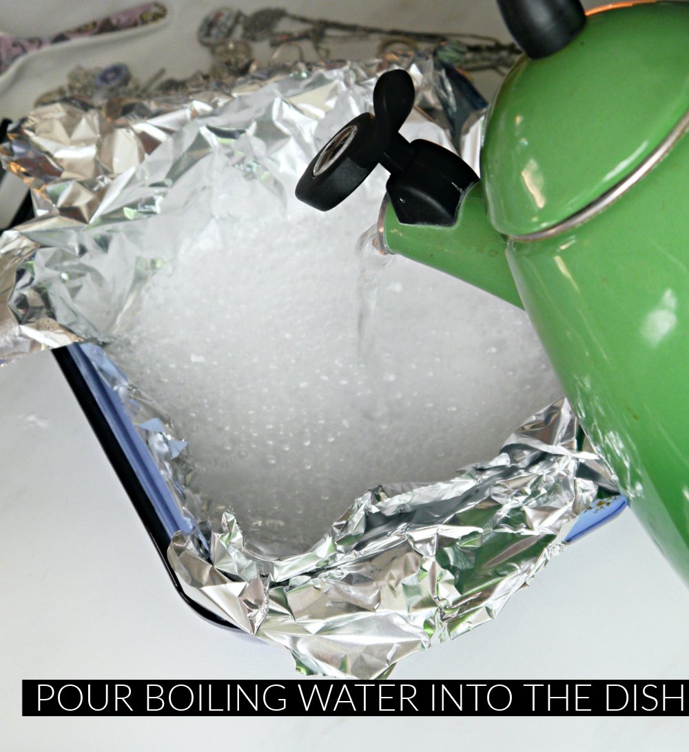 Green tea kettle pouring water in foil lined dish and bubbling. 