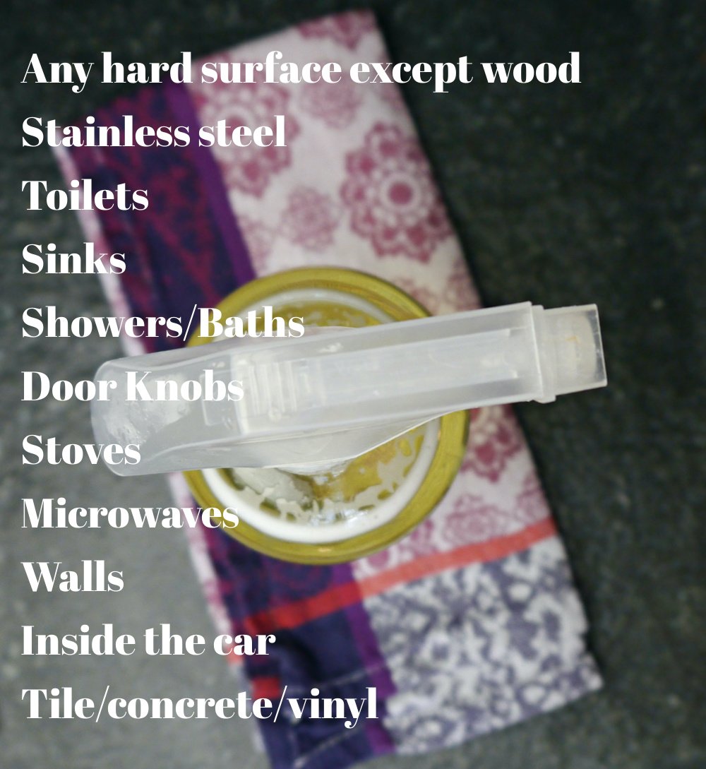 Glass spray bottle with a list of all the things you can clean with this DIY cleaner.
